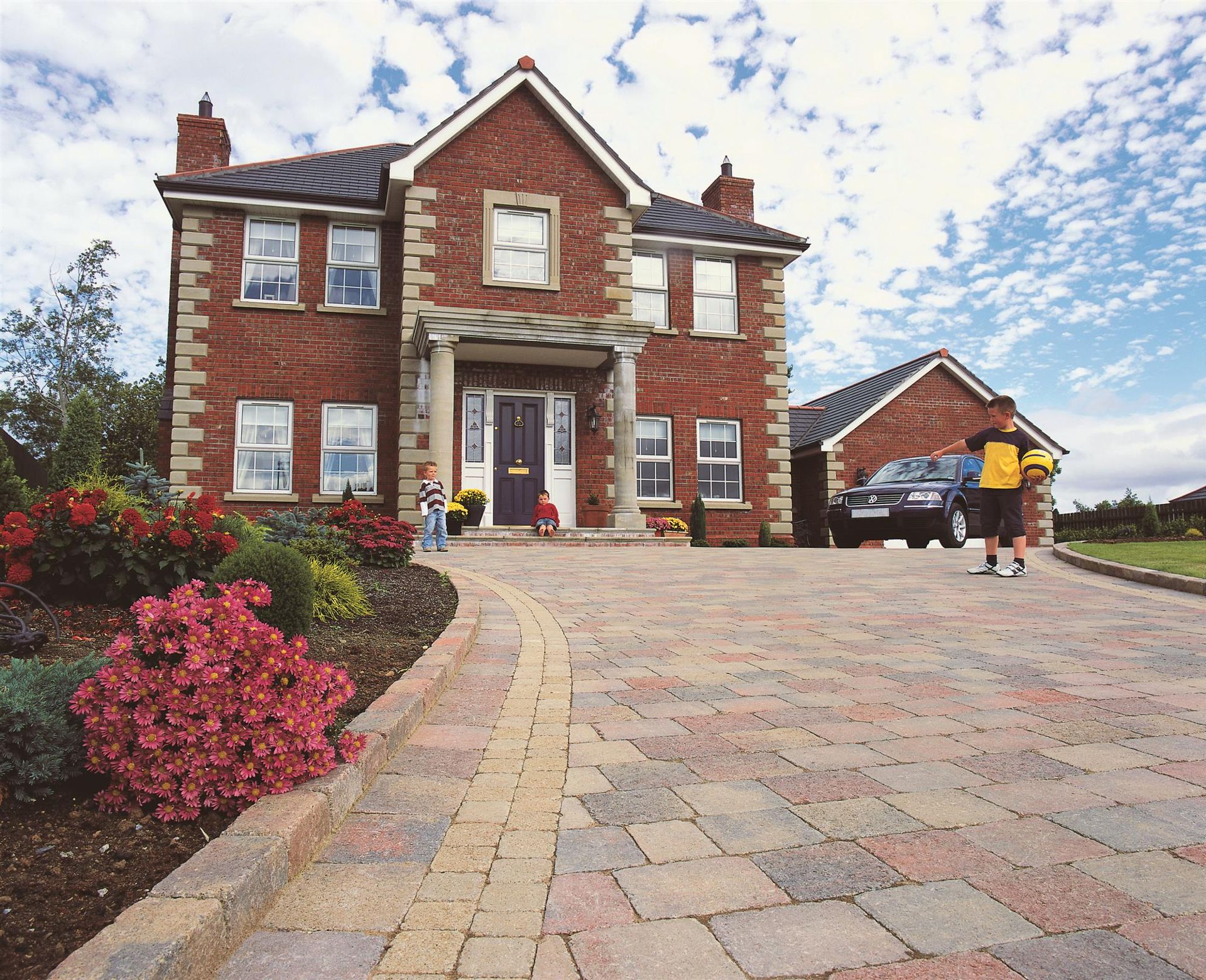 Brick house with a new block-paved driveway